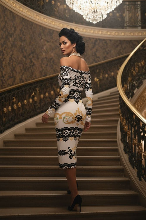 Elegant black and gold lace wrap dress worn by woman posing on grand staircase in luxury evening setting