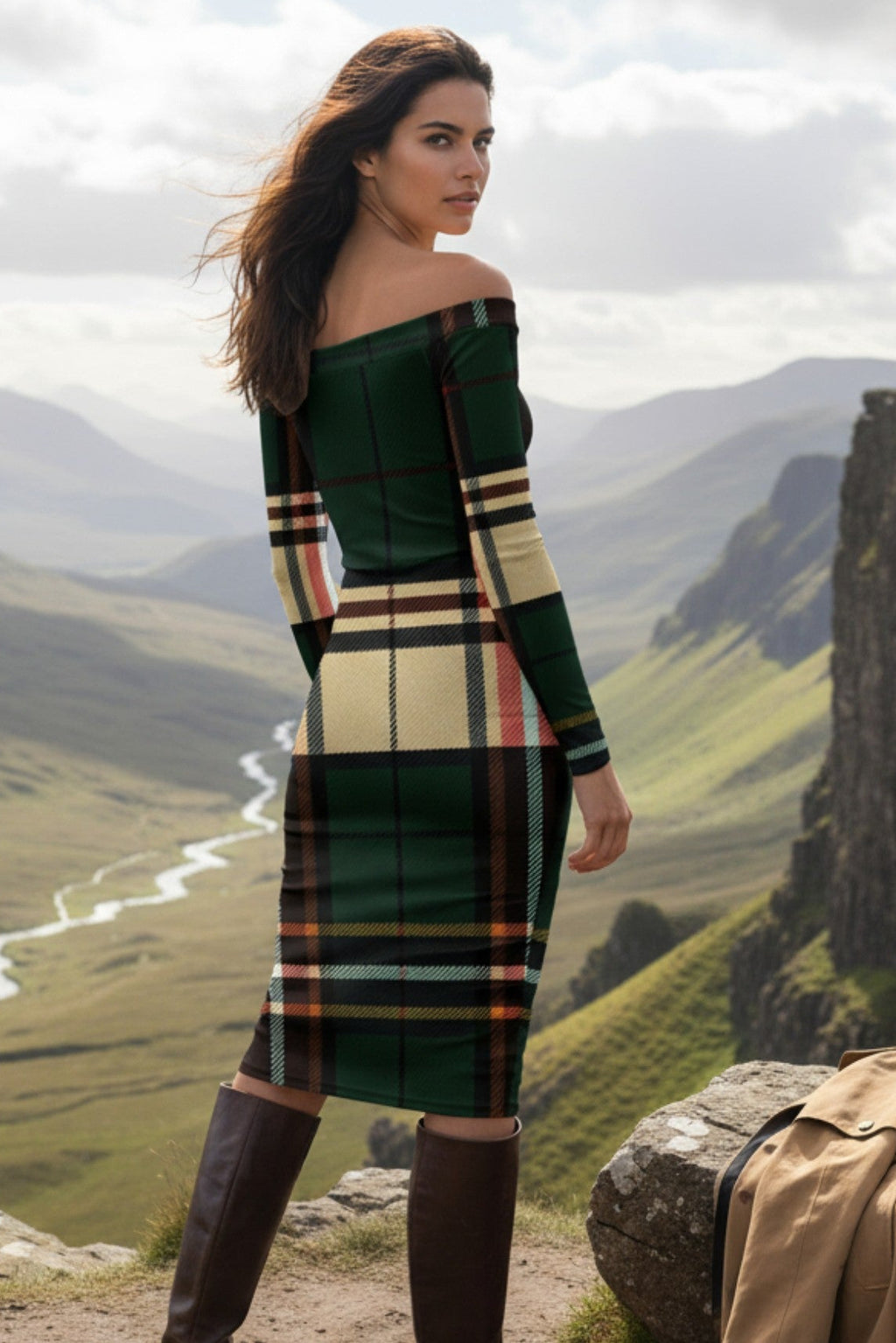 Woman wearing a tartan off the shoulder midi dress by Angelic Blessings Shop standing outdoors with boots