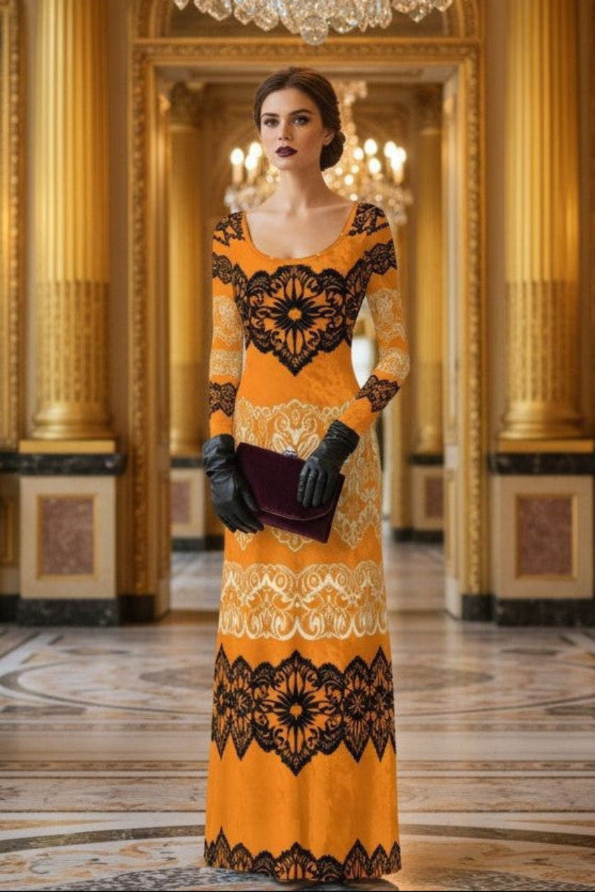 Luxury gold velvet evening gown with intricate black lace patterns worn by model in elegant ballroom